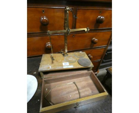 A set of brass balance laboratory scales on wooden stand 