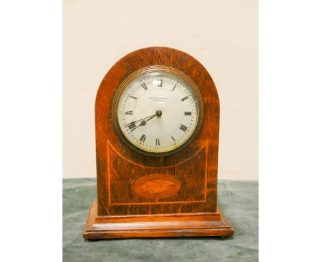An Edwardian mantel clock in shell inlaid oak case, 9" tall 