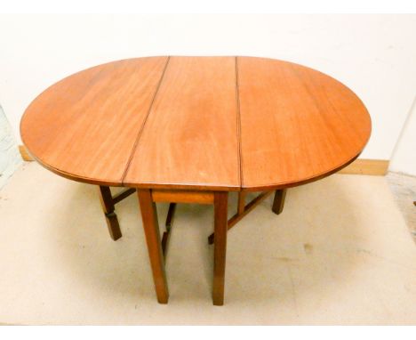 A Georgian mahogany oval drop leaf table with gate leg style base in lovely clean pollished condition 3' wide 