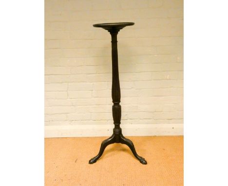 A late Victorian mahogany torchere on reeded stand and tripod base with ball and claw feet 