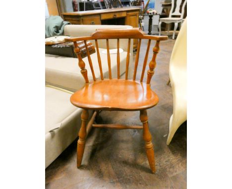 A tub shaped stick back Windsor elbow chair 