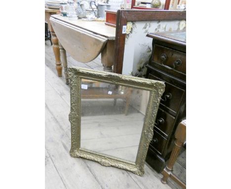 A Victorian style wall mirror in gilt frame and a needlework panel fire screen 