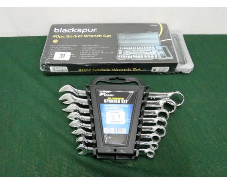 A new 40 piece socket wrench set and a new 8 piece combination spanner set 