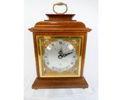 A mahogany cased mantle clock by Elliot, retailed by Garrard &amp; Co Ltd Regent Street, height with handle up 24cms 