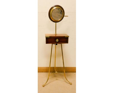 A Victorian mahogany brass bound shaving stand fitted with one drawer on tripod brass legs with a brass framed mirror 