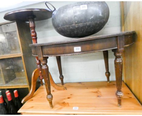 An oval mahogany coffee table and a wine table on a tripod base 