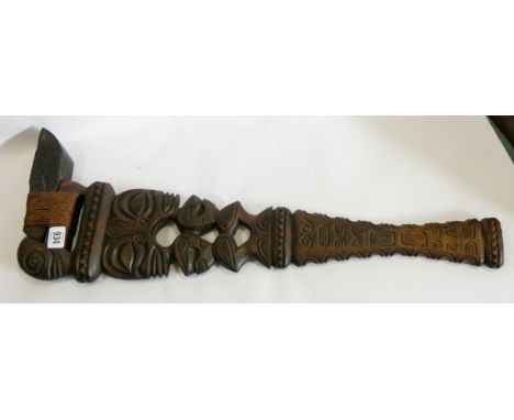 A Maori style carved wood flint mounted war axe 