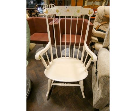 A cream painted stick back rocking elbow chair 