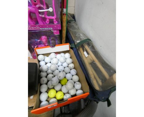 Two fishing rods, a bow and arrow, golf balls, a small croquet set etc 