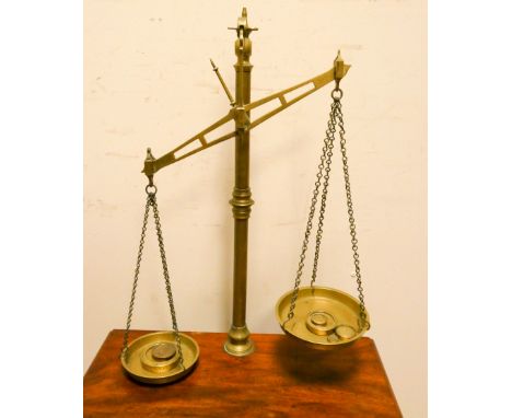 A set of large Victorian brass balance scales with weights 