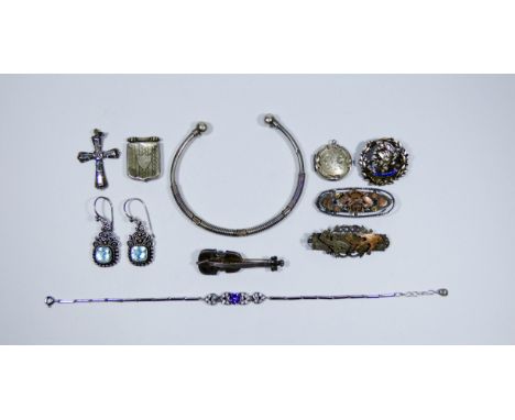 Silver jewellery to include bangle, brooches, earrings and a cross pendant.