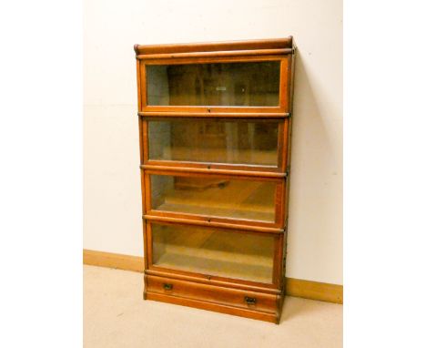 A Globe Wernicke four section oak glazed bookcase with drawer under, 34" wide   Not perfect at back, a piece missing, ply has