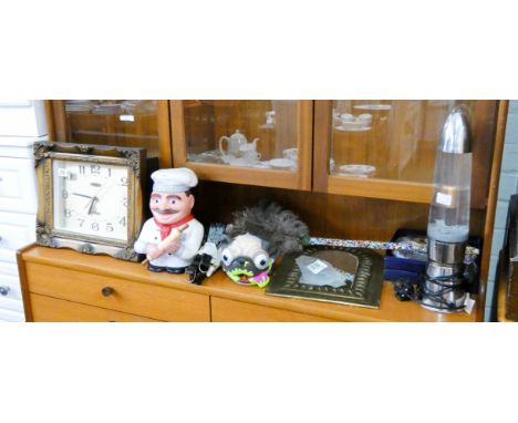 A gilt framed wall clock, cookie jar, lava lamp, mirror, fans and other sundries 