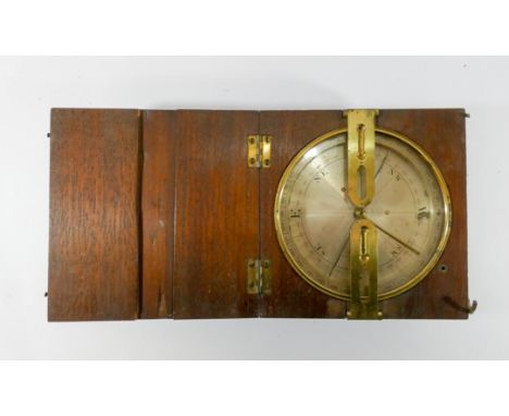 A 19th Century tripod mounted dial compass, in a oak and brass case, signed J Davis of Cheltenham, approximately 15.5cm X 16c