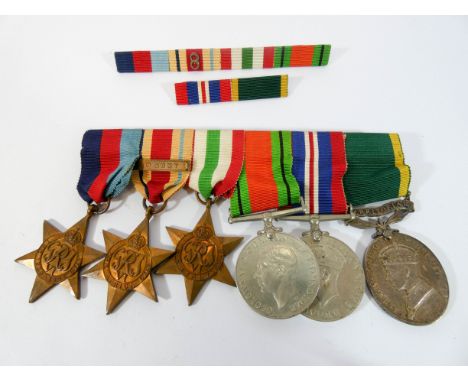 World War II medal group comprising 1939/45 star, Africa Star 8th army bar, Italy Star, Defence Medal, Service Medal and Terr