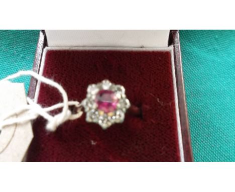 18CT. GOLD RUBY AND DIAMOND CLUSTER RING (Size M 1/2)