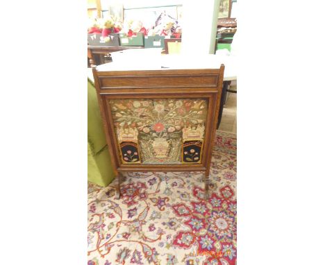 Oak framed fire screen the inset in wool work floral autumn colours