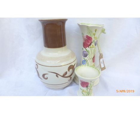 Multi-coloured Elizabeth Radford hand painted jug vase, matching posy vase and a decorative brown and white cylindrical vase 