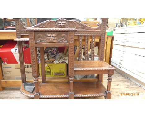 Carved oak hall stand fitted single drawer with seat and umbrella/stick compartment