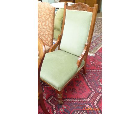 Early 20th Century oak framed fireside chair, the padded back and seat upholstered in light green dralon