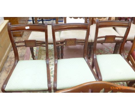 3 matching mahogany framed dining chairs the loose padded seats each upholstered in patterned light green cloth