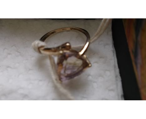 Amethyst/citrine ring in 9ct. gold band (Size O)