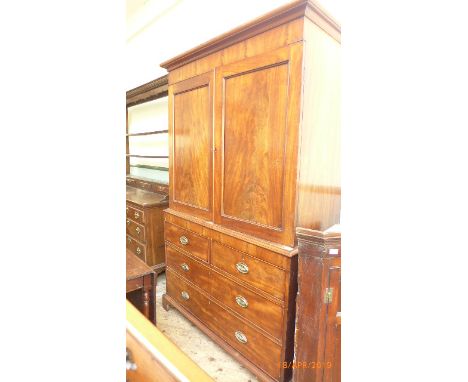 Early 19th century figured mahogany secretaire the upper double panel fitted three storage shelves, the lower with two short 