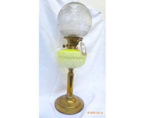 Early 20th century brass circular based oil lamp with mottled yellow bowl and decorative etched domed clear glass shade