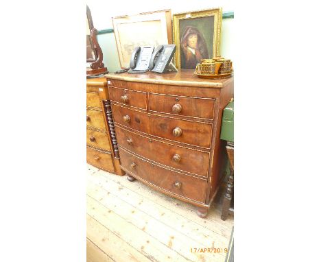 Mahogany bow fronted Victorian chest of two short and three long drawers each with bobbin handles on bun feet (38" wide)