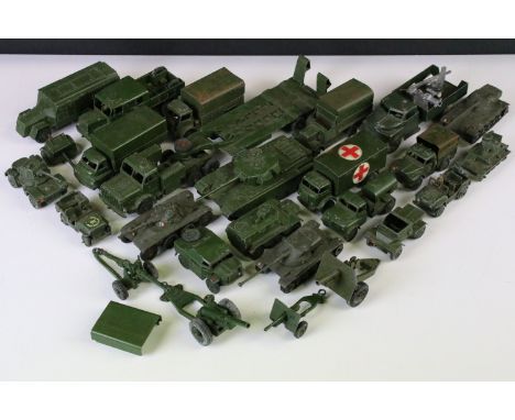 24 Mid 20th C play worn Dinky military diecast models to include Centurion Tank, Tank Transporter, Military Ambulance, Medium