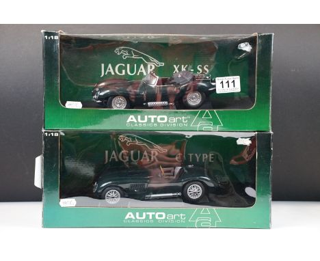 Two boxed 1/18 scale AutoArt diecast models to include 73500 Jaguar C Type in green and 73511 Jaguar XK SS 1956 in green, die