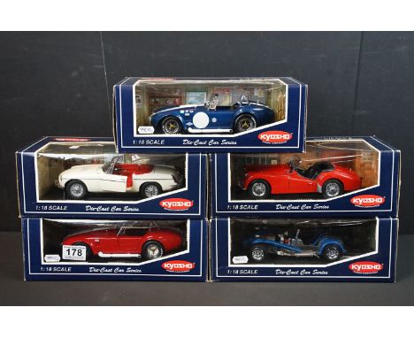 Five boxed 1/18 scale Kyosho diecast models to include 7006SR Shelby 427 S/C (Racing), 7025R Triumph TR3A (Red), 7020BL Cater