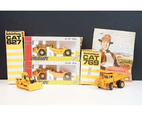 Seven CAT diecast models to include a boxed NZG Schurfzug CAT 627 (the odd paint chip, fair box), Conrad 276 Muldenkipper CAT