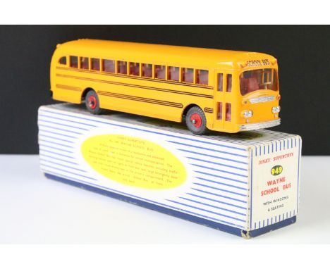 Boxed Dinky Supertoys 949 Wayne School Bus with windows and seating diecast model in yellow with red plastic hubs and black d