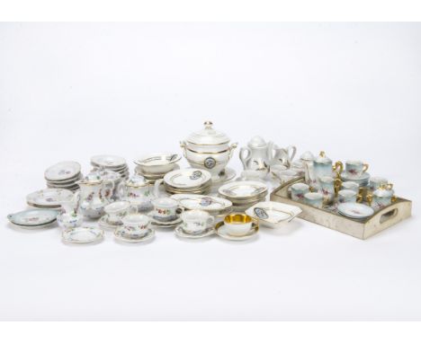 Various doll’s china tea and dinner services, Including a Sevres white cup and saucer with broad gilding, a Continental hand 