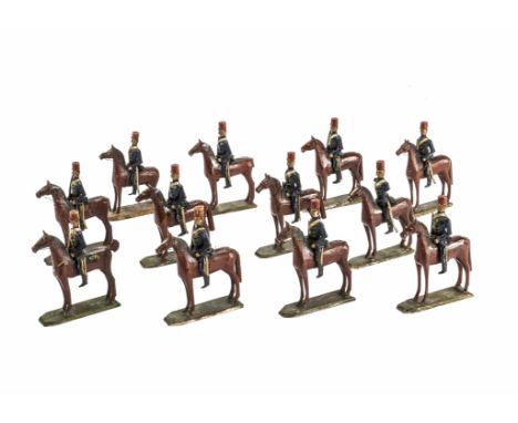 Twelve rare larger scale Erzgebirge carved wooden cavalry figures,  Probably Egyptians, in blue uniforms with red …, mounted 