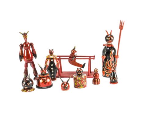 Turned and painted wooden Krampus,  Mainly red and black including five boxes and one on parallel bars —8½in. (21.5cm.) heigh