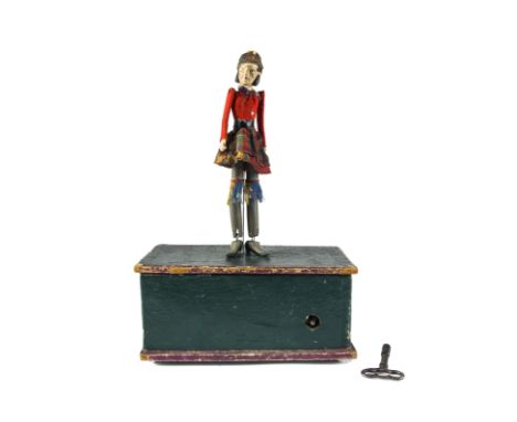 A rare and early English Perry &amp; Co Dancing Scotsman automaton, The composition head with painted brown hair and mutton c