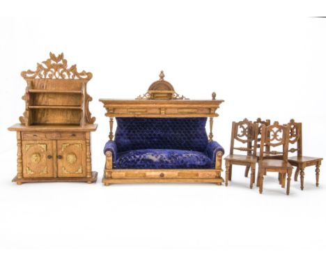 Oak doll’s furniture, A two seater sofa upholstered in purple velvet —12in. (30.5cm.) wide (missing finial); a buffet, the do