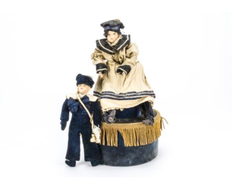 A modern 19th century style automaton of a sailor girl, Sat on a cylindrical base with music mechanism and Jumeau label —17½i