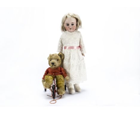 An Armand Marseille Beauty shoulder-head doll,  with blue sleeping eyes, blonde mohair wig, kid Universal jointed body with b