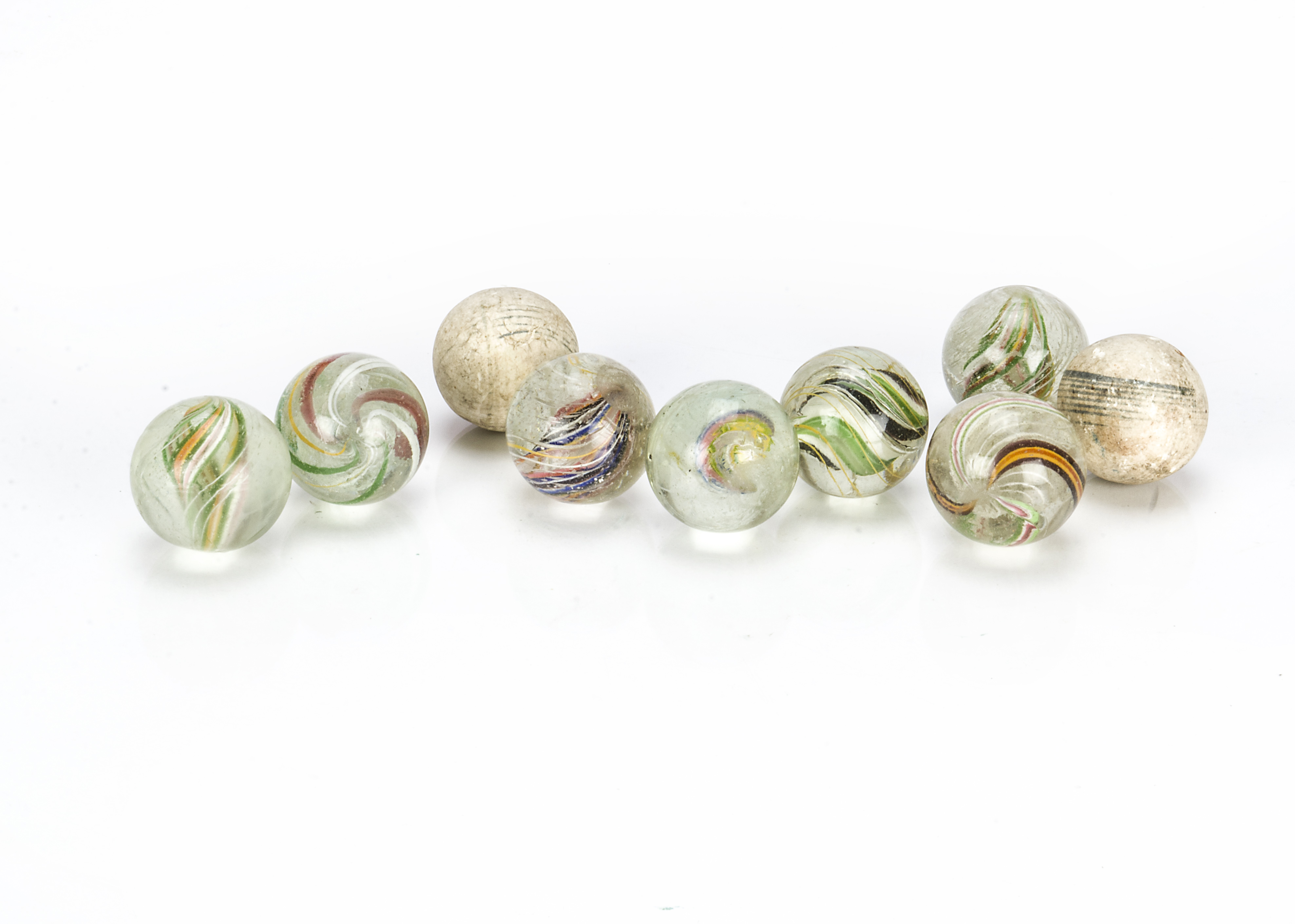 Antique marbles, Seven large hand blown marbles with multicoloured