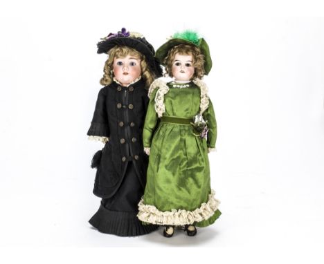 Two German bisque headed child dolls, a Max Handwerck socket head with blue sleeping eyes, modern wig, jointed composition bo