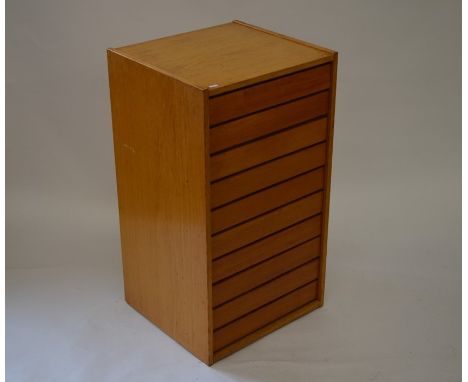 A ten drawer beech collector cabinet/plan chest, the push-open drawers with glazed lids, 88 cm tall, 49 cm wide, 45.5 cm diam