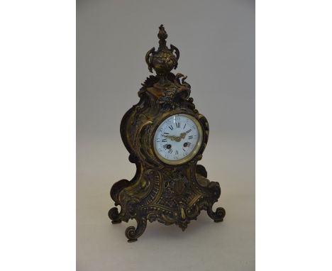 A 19th century French ornate cast brass mantle clock with enamelled dial and twin train movement, 46 cm high, a/f