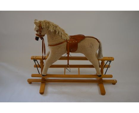 A fur fabric coated child's rocking horse