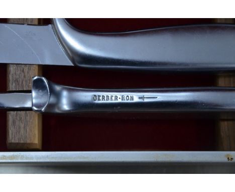A Gerber cased carving set comprising knife, fork and steel