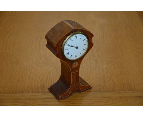 An Art Nouveau mantle clock of balloon form, with satinwood and mother of pearl inlay, white ceramic dial, 24 cm high
