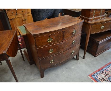 A small mahogany chest of two short over two long drawers raised on splayed bracket feet, 87cm h x 90cm w x 50cm d