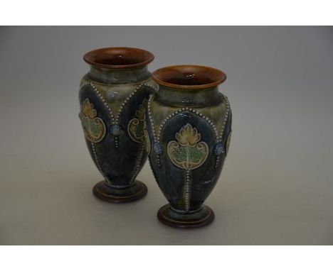 An Aldermaster pottery foliate design jug, 19.5 cm high to/w a Poole Duo tone milk jug, pair of Doulton Lambeth stoneware vas